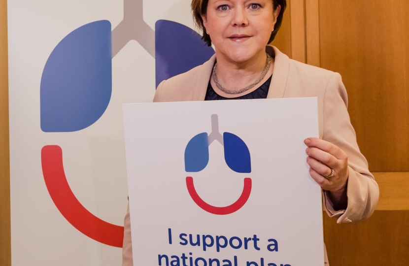 Maria Miller with poster