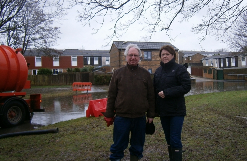 Maria Miller MP and Cllr Stephen Reid at the flooded area in Buckskin in February 2014. Cllr Reid chaired the implementation the new scheme 